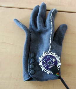 Glove with an LED in the finger that lights up when hand signaling