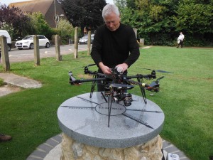 Alan sets up the drone for aerial photographs on the Jubilee plinth on Tayne Field