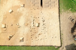 A close up of the overlapping post-built timber halls in trench 1, positioned over the Bronze Age barrow and the clay at the edge of the midden