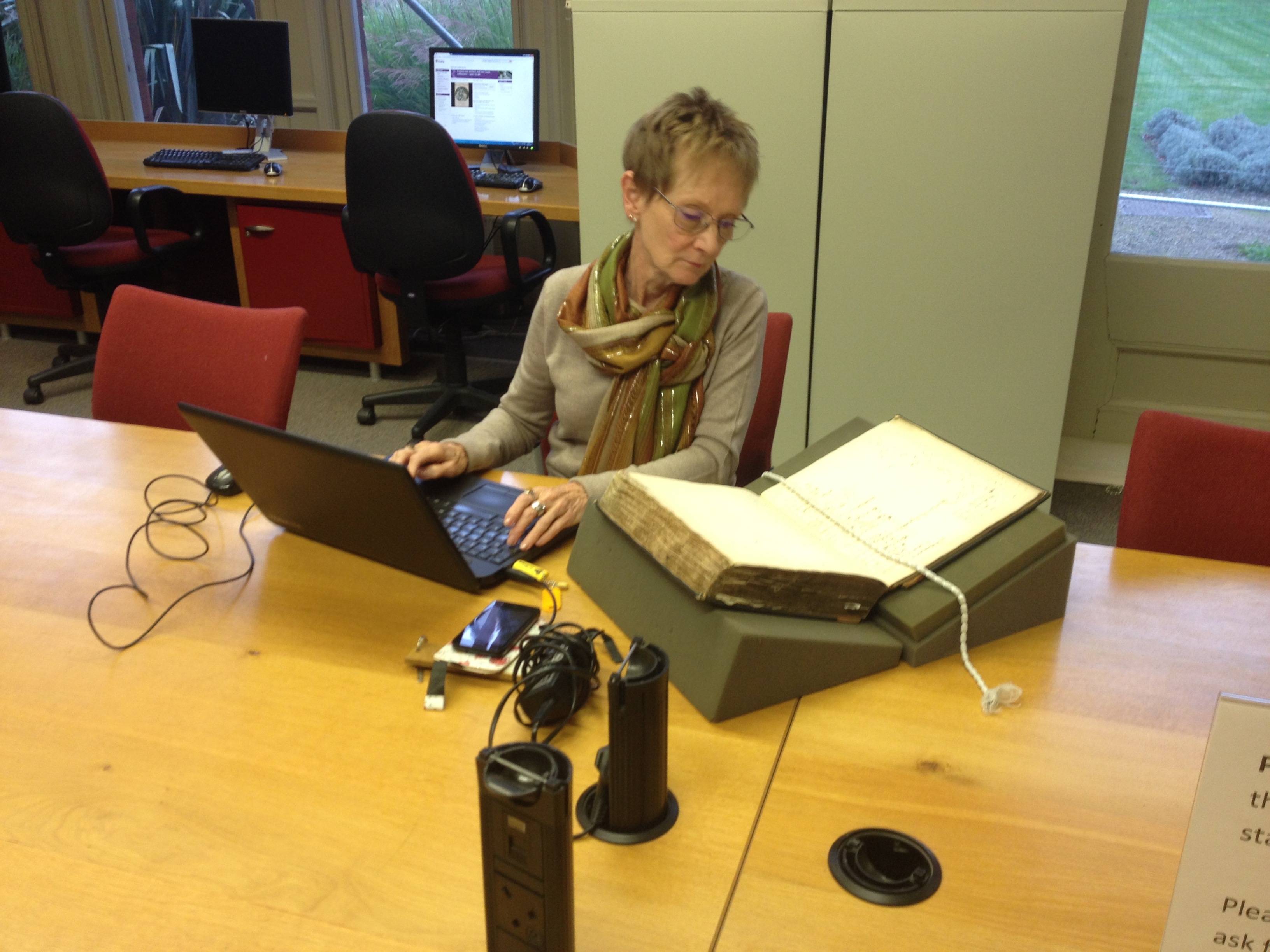 Jenny recording details from one of the many Chatto & Windus letter books.