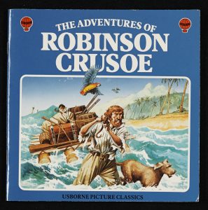 A blue book cover with a picture of the sea and Robinson Crusoe with a boat, parrot and dog.