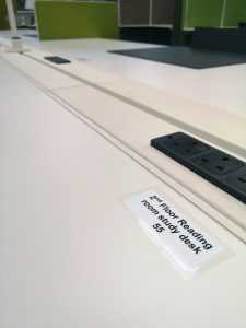 CLose up picture of a desk showing a label with number