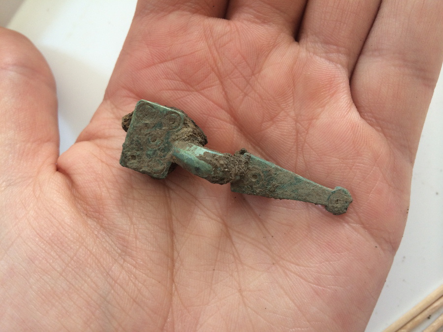 A beautifully preserved square-headed small long brooch excavated from the 'blob' or Anglo-Saxon surface midden