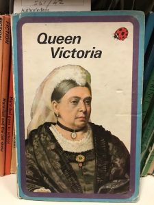 A children's book with a white background, and the text Queen Victoria. An older woman is on the cover, wearing black clothes and a white veil.