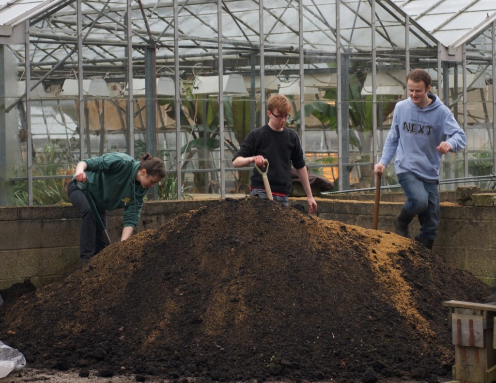 Maria, Luke and Justin mixing three tonnes of compost.  This is just the start!