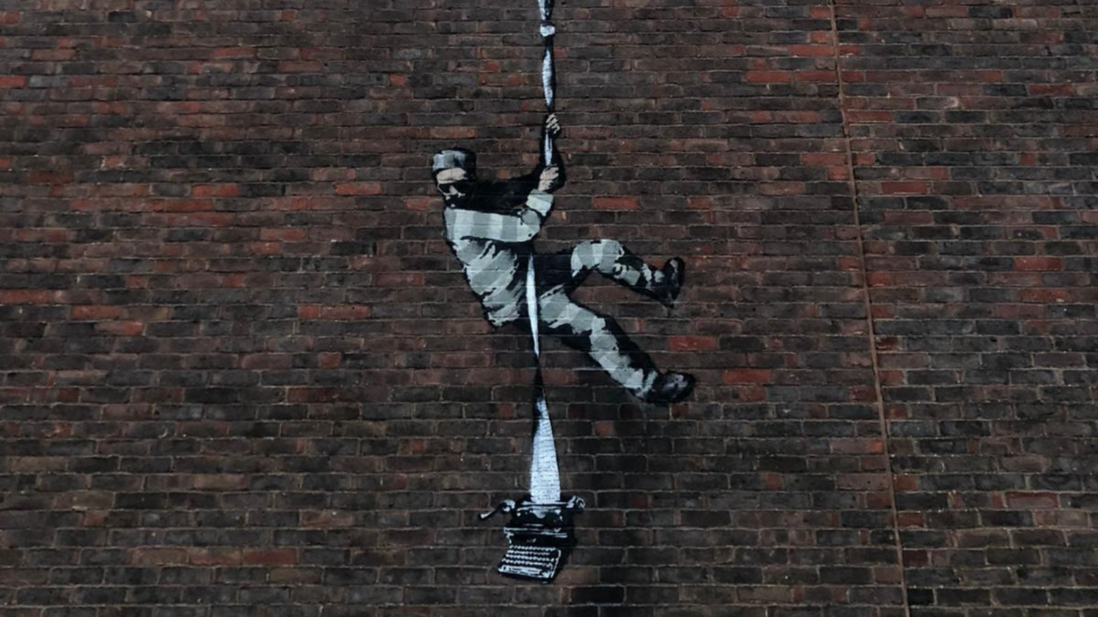 Banksy artwork on the old Reading Prison.
