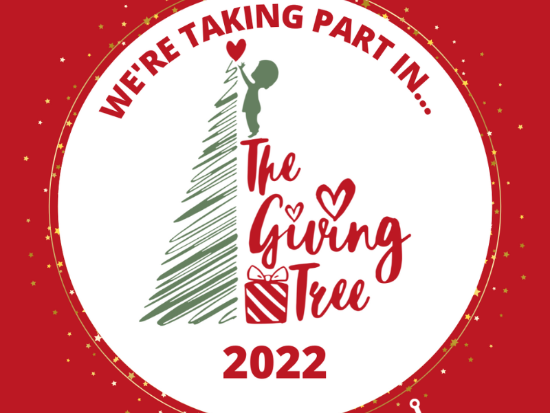 Text "We're taking part in The Giving Tree 2022" with a child putting a heart on top of a tree