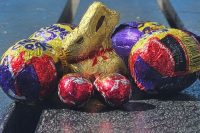 a mini chocolate bunny surrounded by chocolate eggs