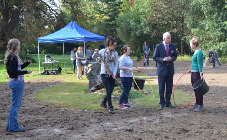 The Vice Chancellor, Sir David Bell, with volunteers at the Harris Garden seed sowing site.